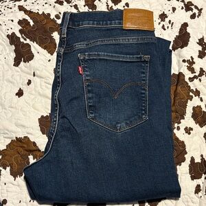 Levi's women’s  Dark Blue 311 showing skinny Jeans